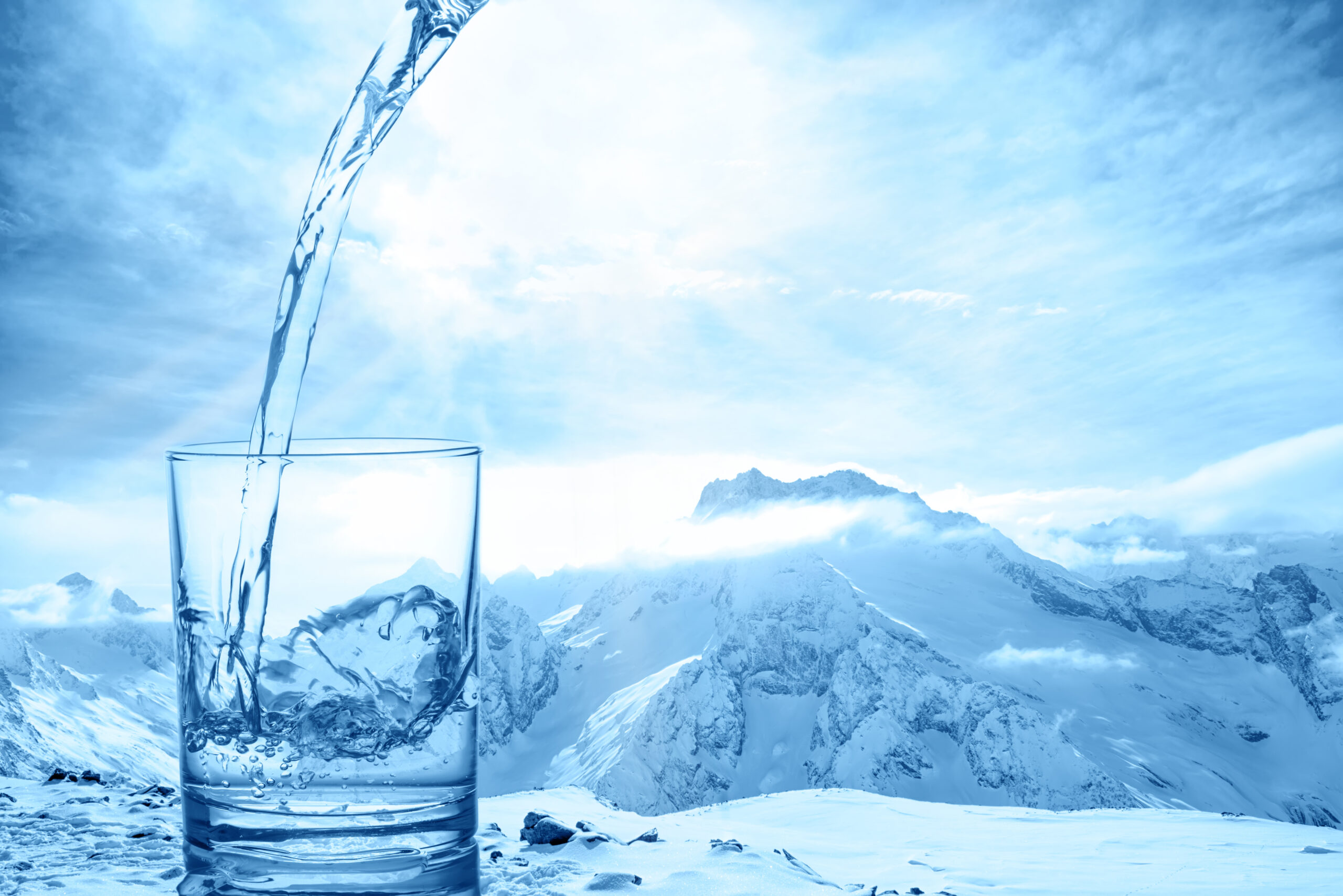 Glass of chilled sparkling water with a lemon slice